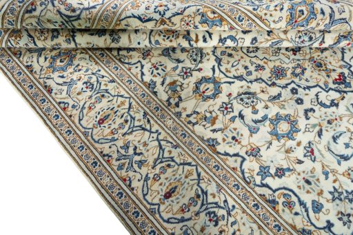 Close-up detail of 2000s Kashan rug from Iran / Persia showing Wool weave