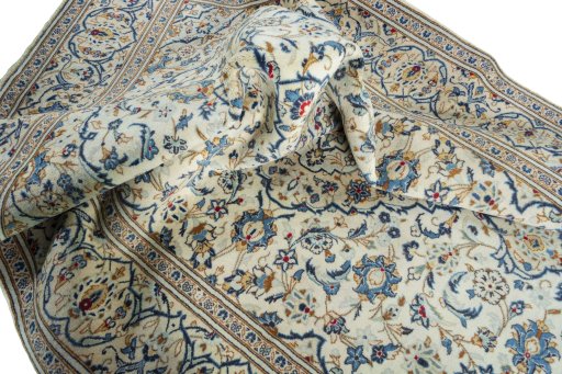 Surface texture of 2000s Kashan rug with natural Wool and intricate pattern