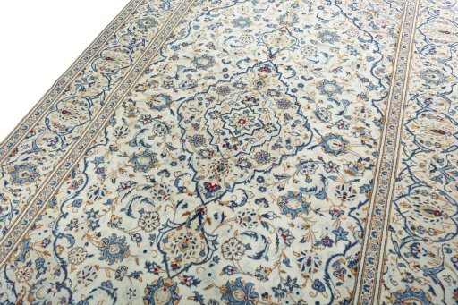 Backside of handmade 2000s Kashan rug showing knot structure and weave density