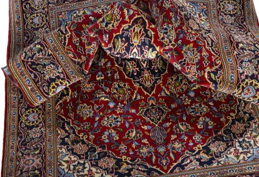 Surface texture of 2000s Kashan rug with natural Cork and intricate pattern