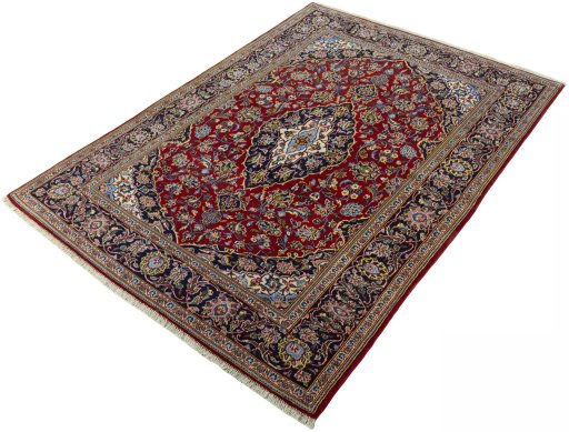 Corner detail of 2000s Kashan rug showing border pattern and Cork pile