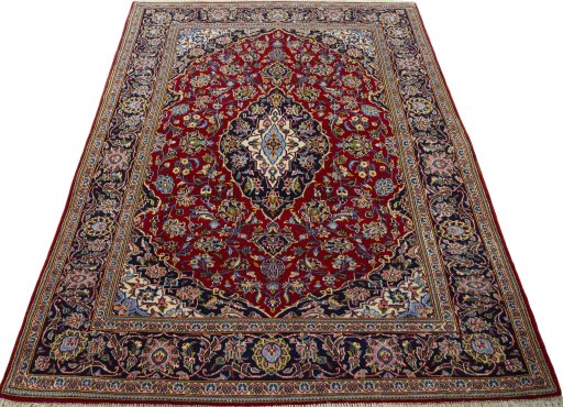 Surface texture of 2000s Kashan rug with natural Cork and intricate pattern