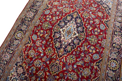 Backside of handmade 2000s Kashan rug showing knot structure and weave density