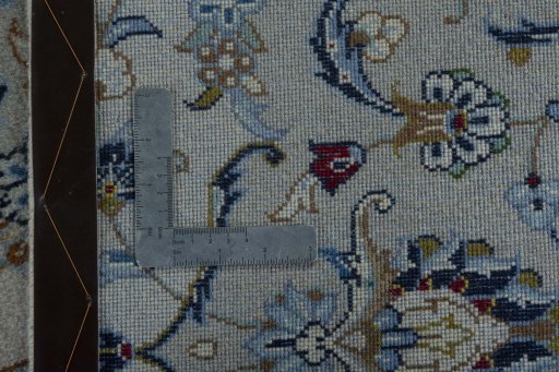 Backside of handmade New Kashan rug showing knot structure and weave density