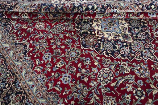 Close-up detail of 2000s Kashan rug from Iran / Persia showing Wool weave