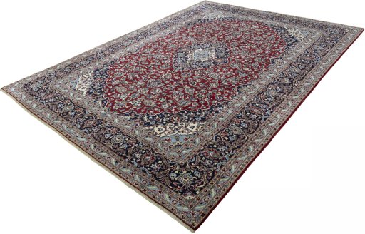 Corner detail of 2000s Kashan rug showing border pattern and Wool pile