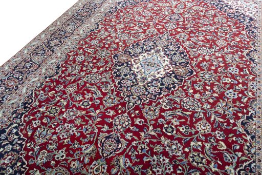 Backside of handmade 2000s Kashan rug showing knot structure and weave density