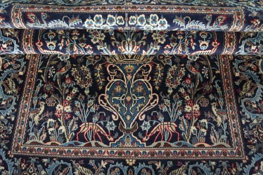 Close-up detail of 2000s Kashan rug from Iran / Persia showing Wool weave