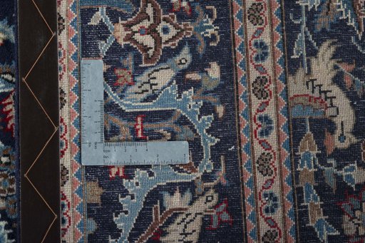 Backside of handmade 2000s Kashan rug showing knot structure and weave density
