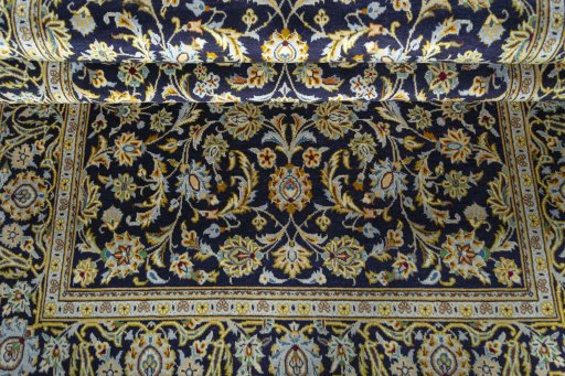 Close-up detail of 1970s Kashan rug from Iran / Persia showing Wool weave