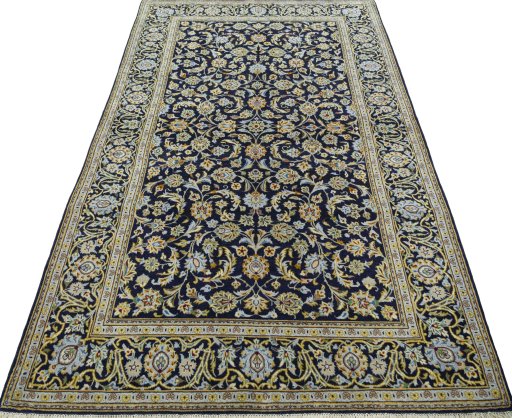 Surface texture of 1970s Kashan rug with natural Wool and intricate pattern
