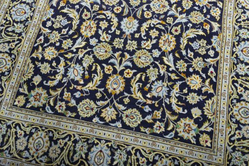 Close-up detail of 1970s Kashan rug from Iran / Persia showing Wool weave