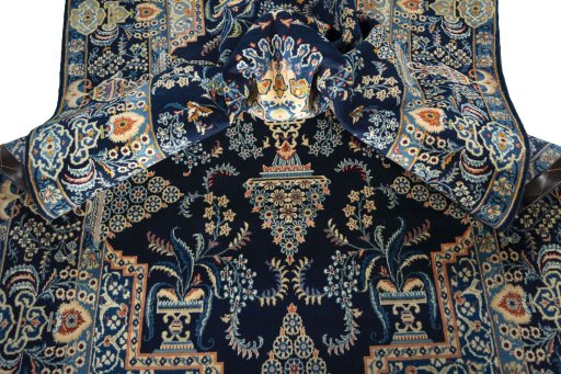 Close-up detail of 2000s Kashan rug from Iran / Persia showing Wool weave
