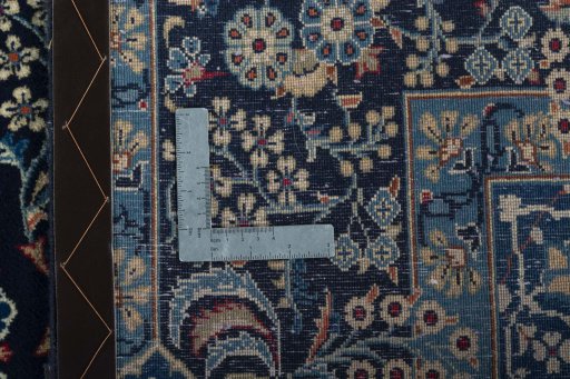 Surface texture of 2000s Kashan rug with natural Wool and intricate pattern