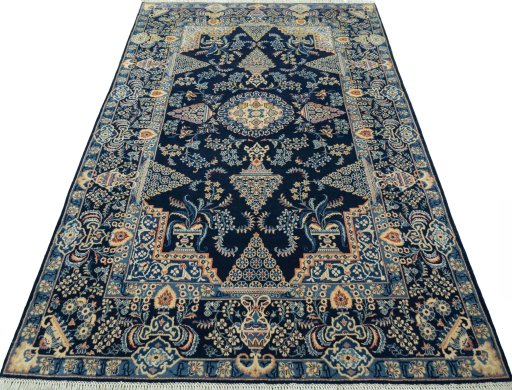 Surface texture of 2000s Kashan rug with natural Wool and intricate pattern