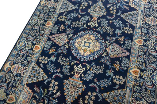 Backside of handmade 2000s Kashan rug showing knot structure and weave density