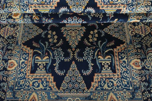 Corner detail of 2000s Kashan rug showing border pattern and Wool pile