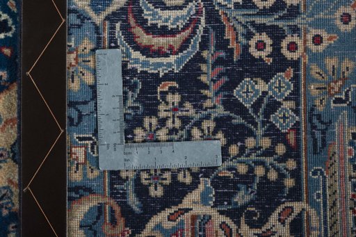 Surface texture of 2000s Kashan rug with natural Wool and intricate pattern