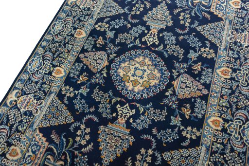 Backside of handmade 2000s Kashan rug showing knot structure and weave density