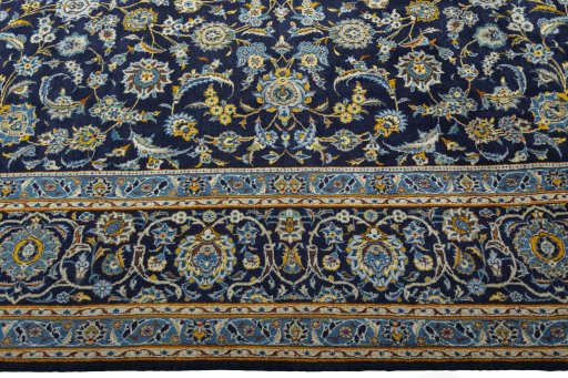 Corner detail of 1970s Kashan rug showing border pattern and Wool pile
