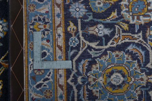 Backside of handmade 1970s Kashan rug showing knot structure and weave density
