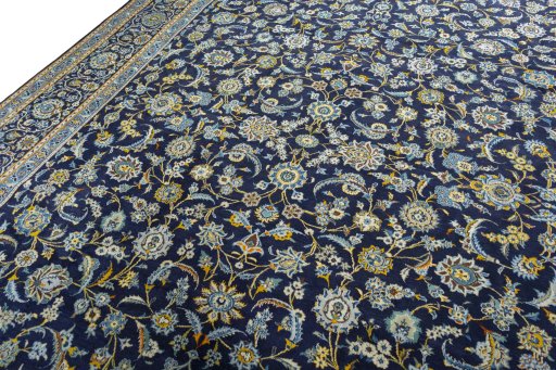 Backside of handmade 1970s Kashan rug showing knot structure and weave density