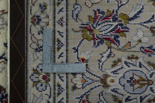 Backside of handmade New Kashan rug showing knot structure and weave density