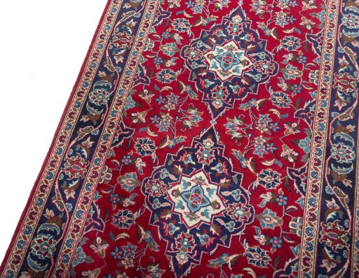 Backside of handmade 2000s Kashan rug showing knot structure and weave density