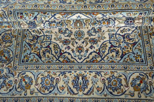 Close-up detail of 2000s Kashan rug from Iran / Persia showing Wool weave