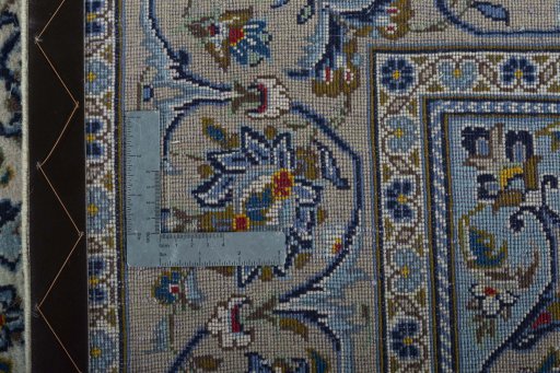 Backside of handmade 2000s Kashan rug showing knot structure and weave density