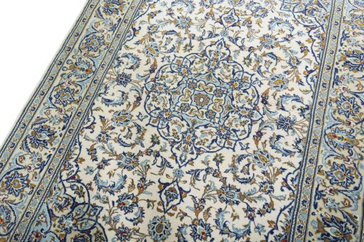 Backside of handmade 2000s Kashan rug showing knot structure and weave density