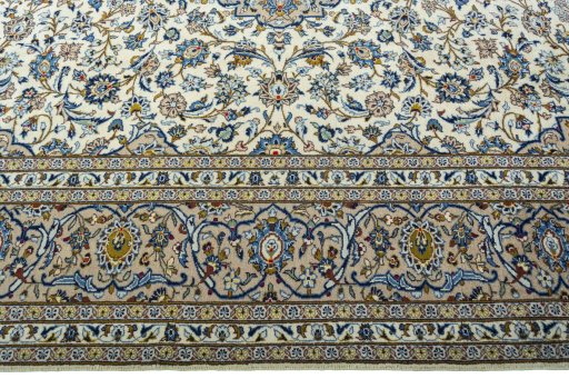 Corner detail of 2000s Kashan rug showing border pattern and Wool pile