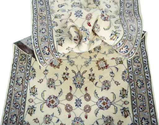 Corner detail of 2000s Kashan rug showing border pattern and Wool pile