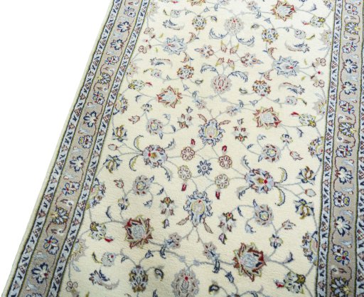 Backside of handmade 2000s Kashan rug showing knot structure and weave density