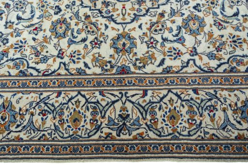 Corner detail of 2000s Kashan rug showing border pattern and Wool pile