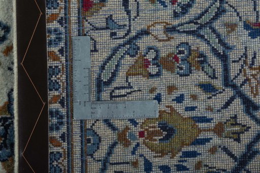 Backside of handmade 2000s Kashan rug showing knot structure and weave density