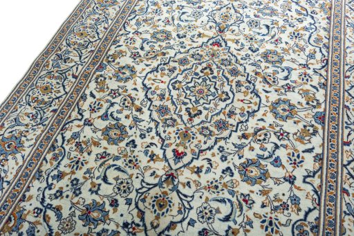 Backside of handmade 2000s Kashan rug showing knot structure and weave density