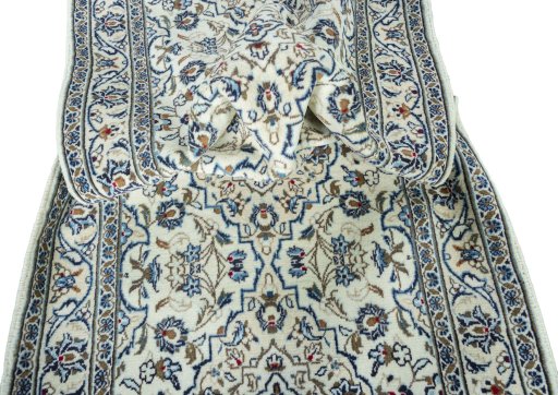 Close-up detail of New Kashan rug from Iran / Persia showing Wool weave