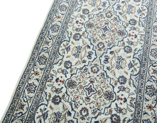 Backside of handmade New Kashan rug showing knot structure and weave density