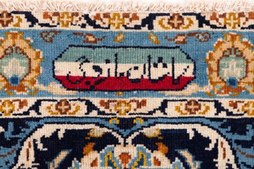 Corner detail of 1980s Kashan rug showing border pattern and Wool pile