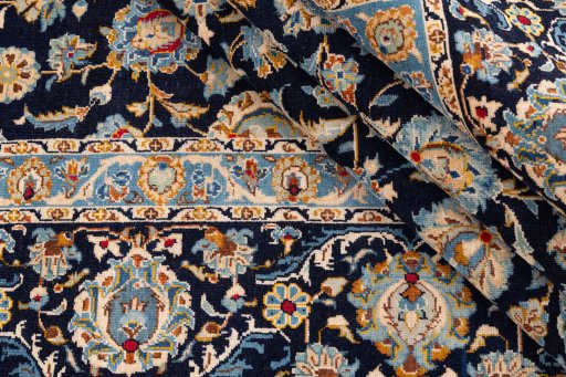 Close-up detail of 1980s Kashan rug from Iran / Persia showing Wool weave