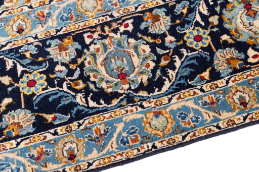 Backside of handmade 1980s Kashan rug showing knot structure and weave density