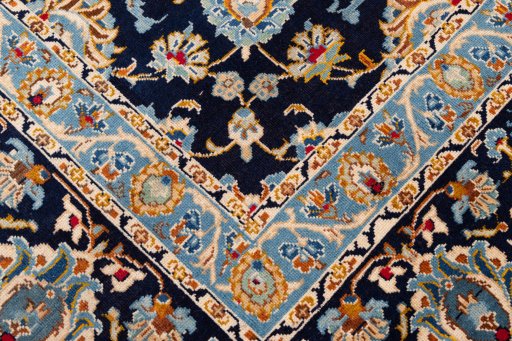 Close-up detail of 1980s Kashan rug from Iran / Persia showing Wool weave