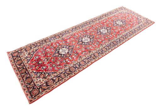 Corner detail of 1999s Kashan rug showing border pattern and Wool pile