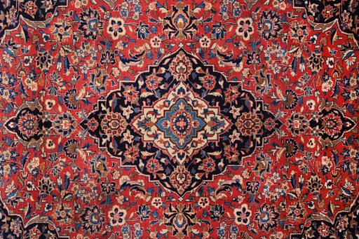 Corner detail of 1980s Kashan rug showing border pattern and Wool pile