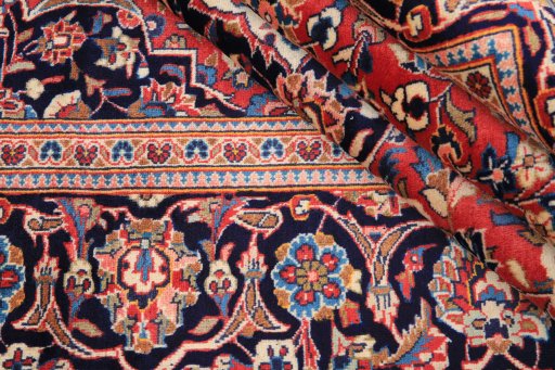 Close-up detail of 1980s Kashan rug from Iran / Persia showing Wool weave