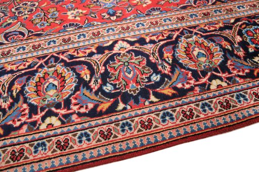 Backside of handmade 1990s Kashan rug showing knot structure and weave density