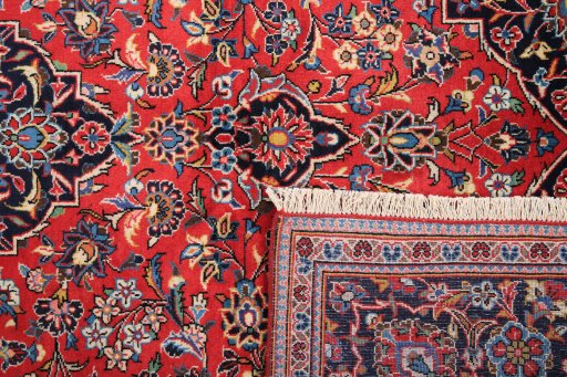 Full view of 1990s Kashan rug from Iran / Persia, 305 × 197 cm in Red tones