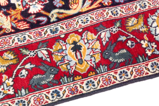 Backside of handmade 2000s Kashan rug showing knot structure and weave density