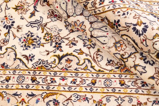 Close-up detail of 1988s Kashan rug from Iran / Persia showing Wool weave